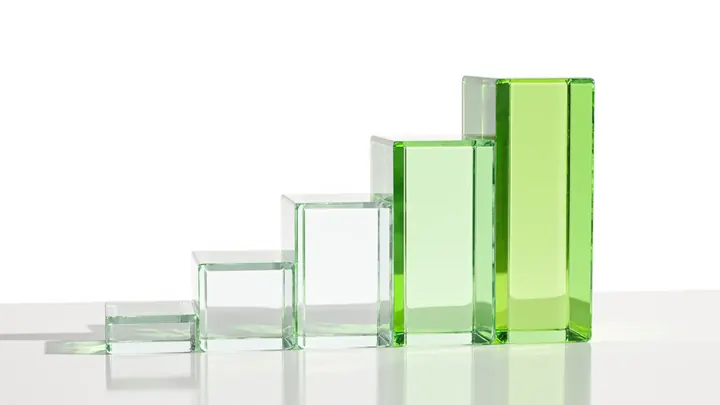 Clear glass blocks rising in steps, the tallest tinted lime green