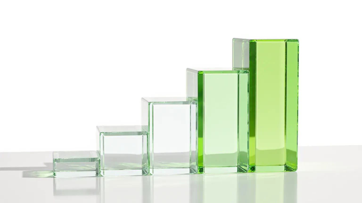 Clear glass blocks rising in steps, the tallest tinted lime green