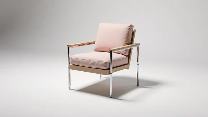 A made-to-measure oak and chrome armchair with pink cushions in a bright studio