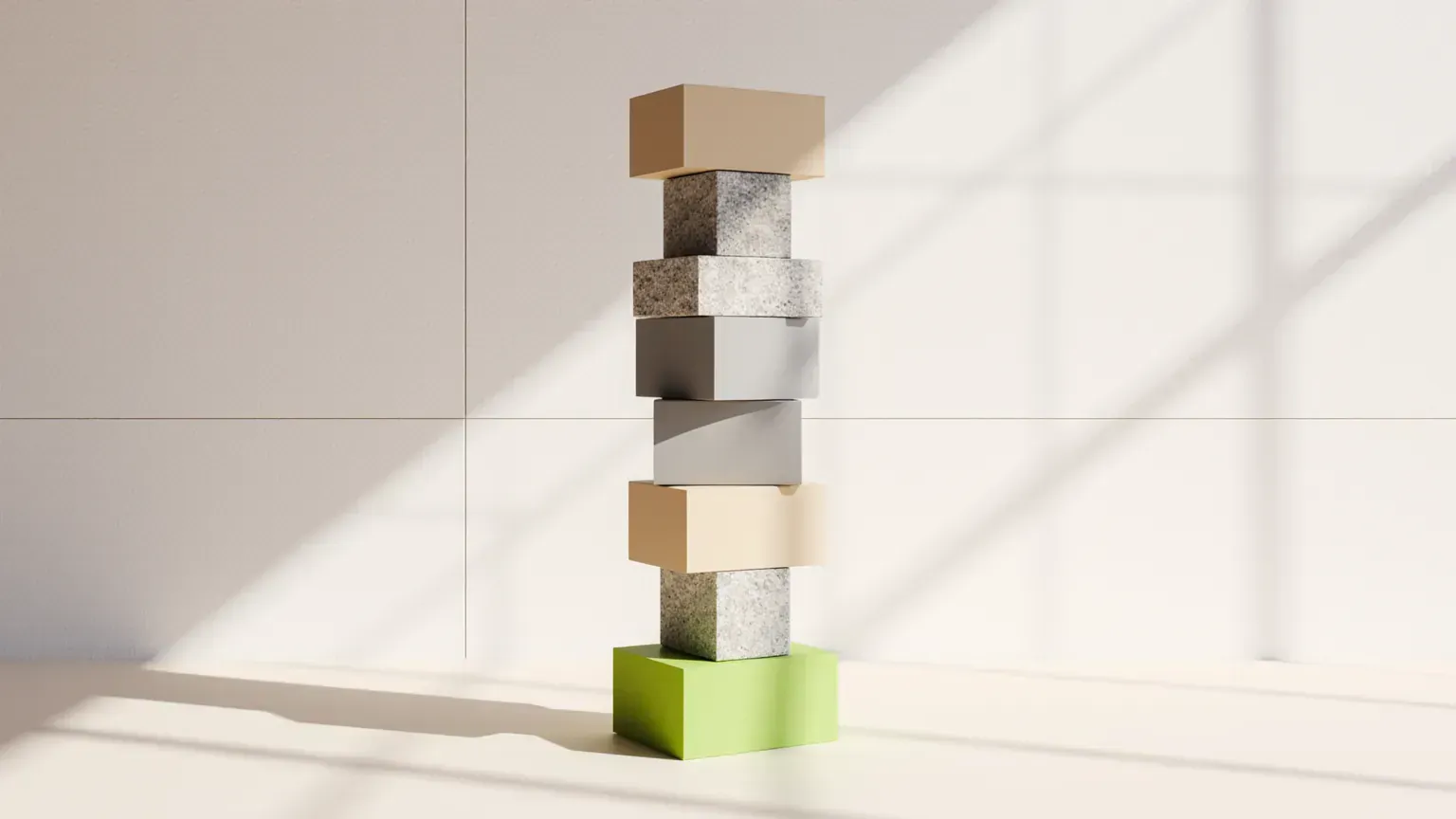 A tall stack of stone and sand-coloured blocks with a lime block at the base, standing for the parts of a video ad budget